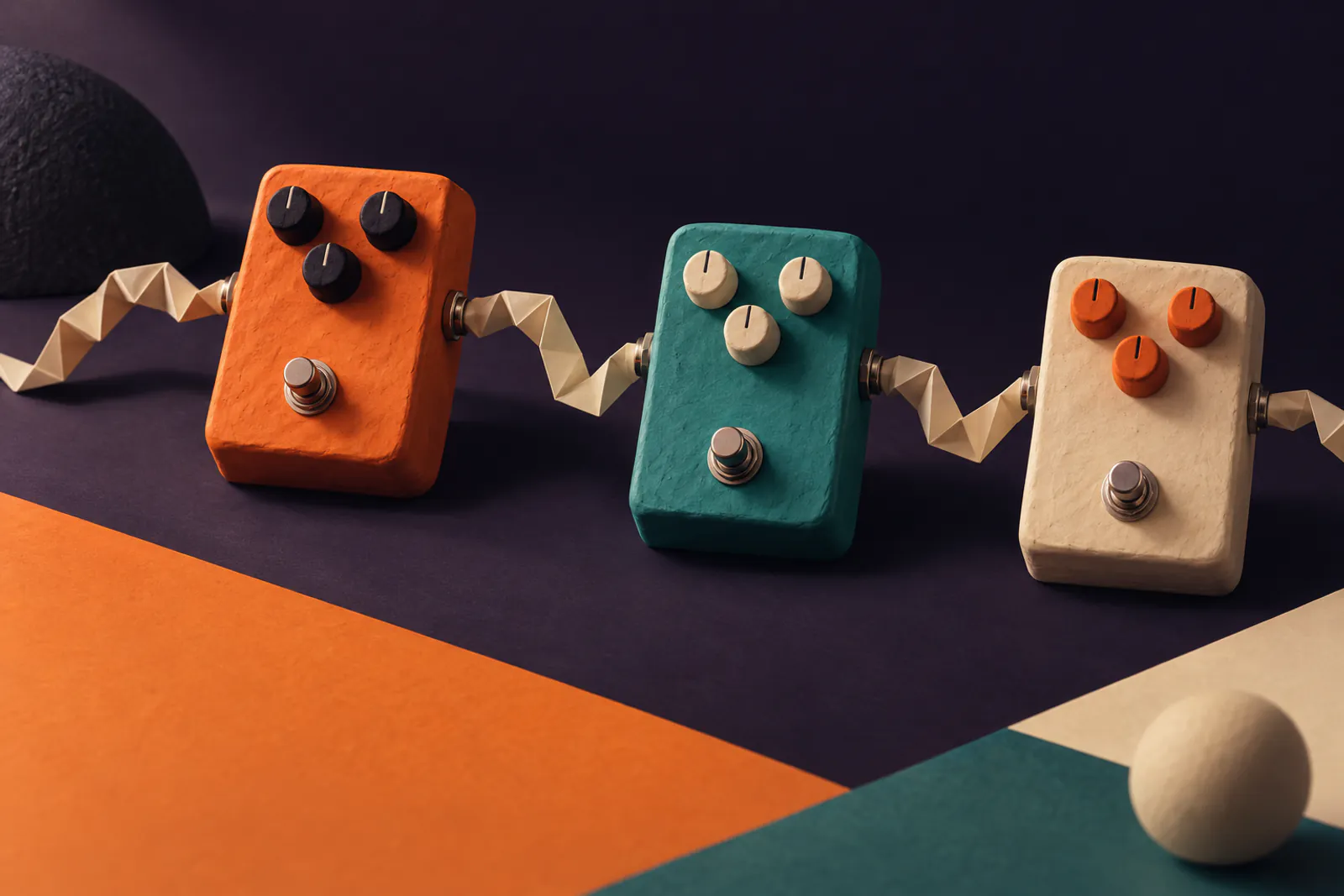 Illustration: a row of chunky clay effect pedals in tangerine, teal and cream on a dark violet field, a folded paper cable looping between them.
