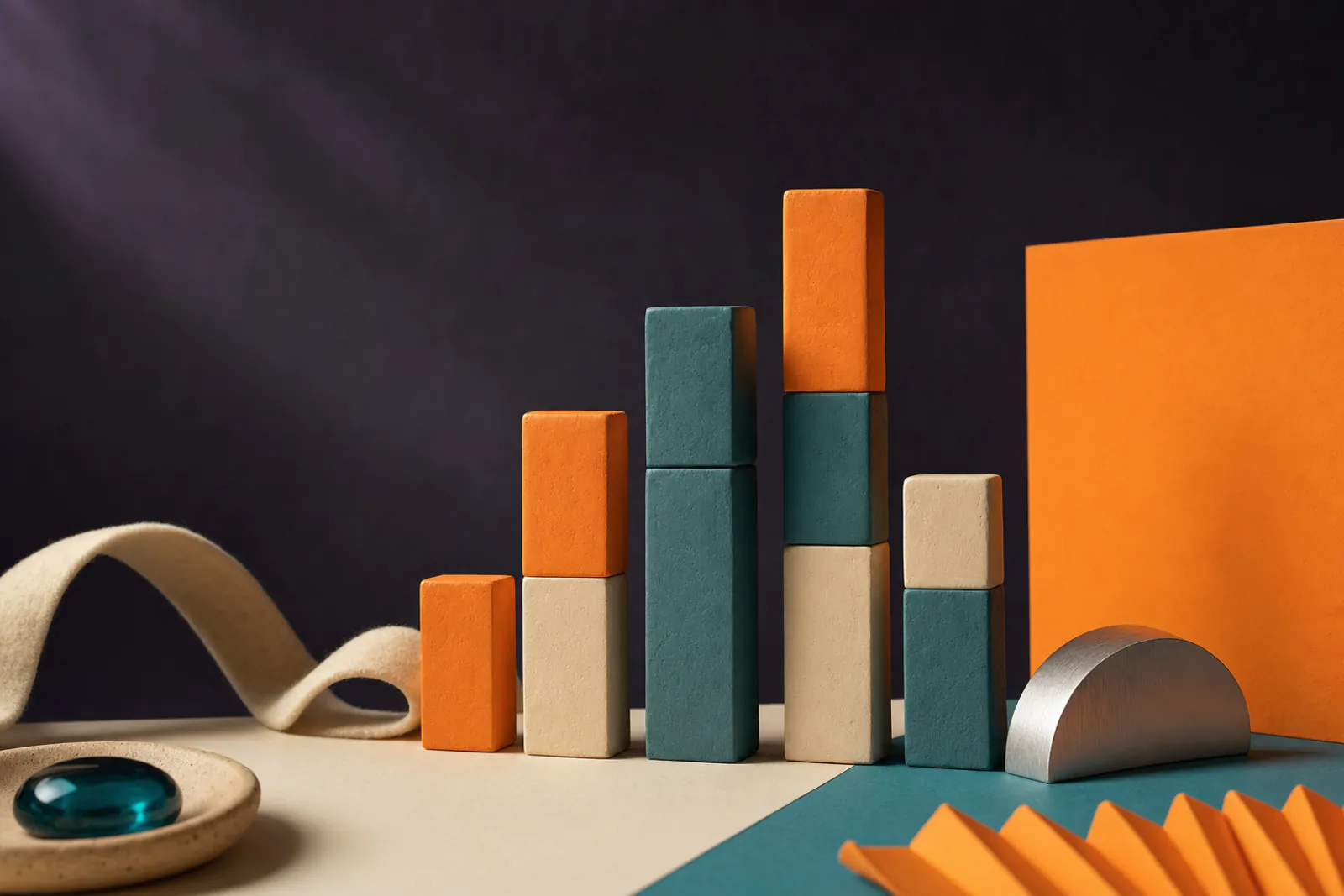 Illustration: stacked clay blocks of different heights in orange, teal and cream arranged like the sections of a song.